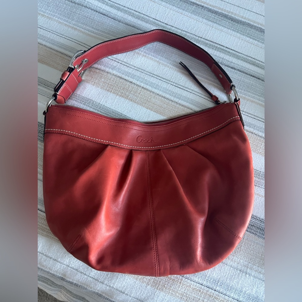 Coach all leather red/orange shoulder purse with silver buckle detail
